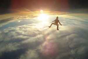 Realy cool slow shot of a skydiving wit sun going under